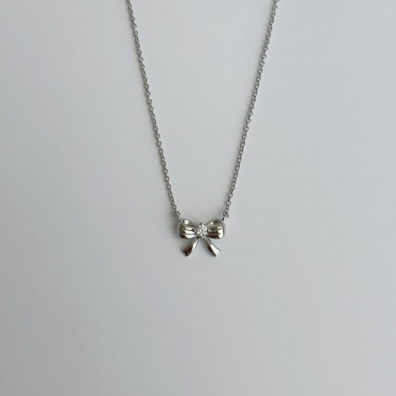 Silver ribbon bow necklace