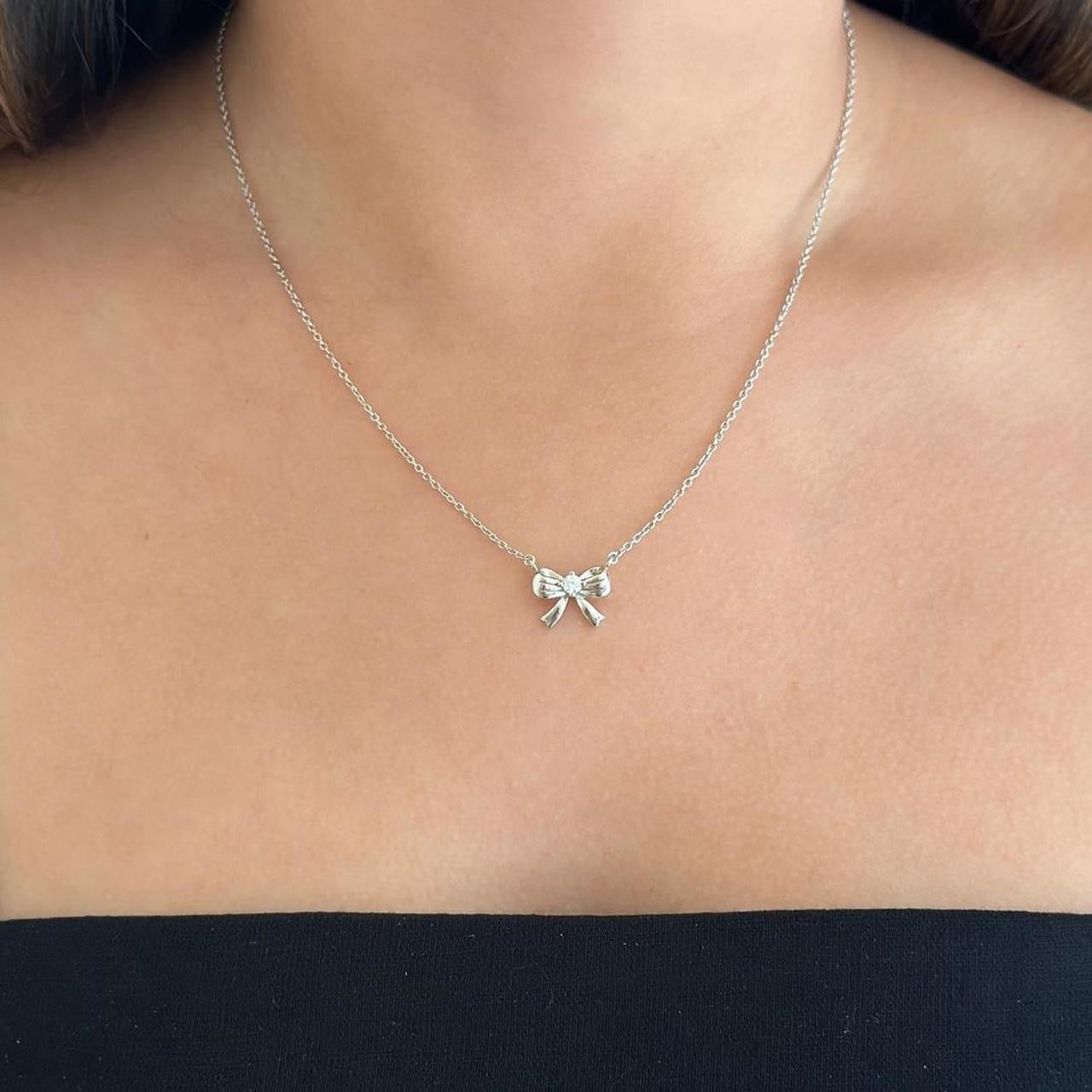 Silver ribbon bow necklace