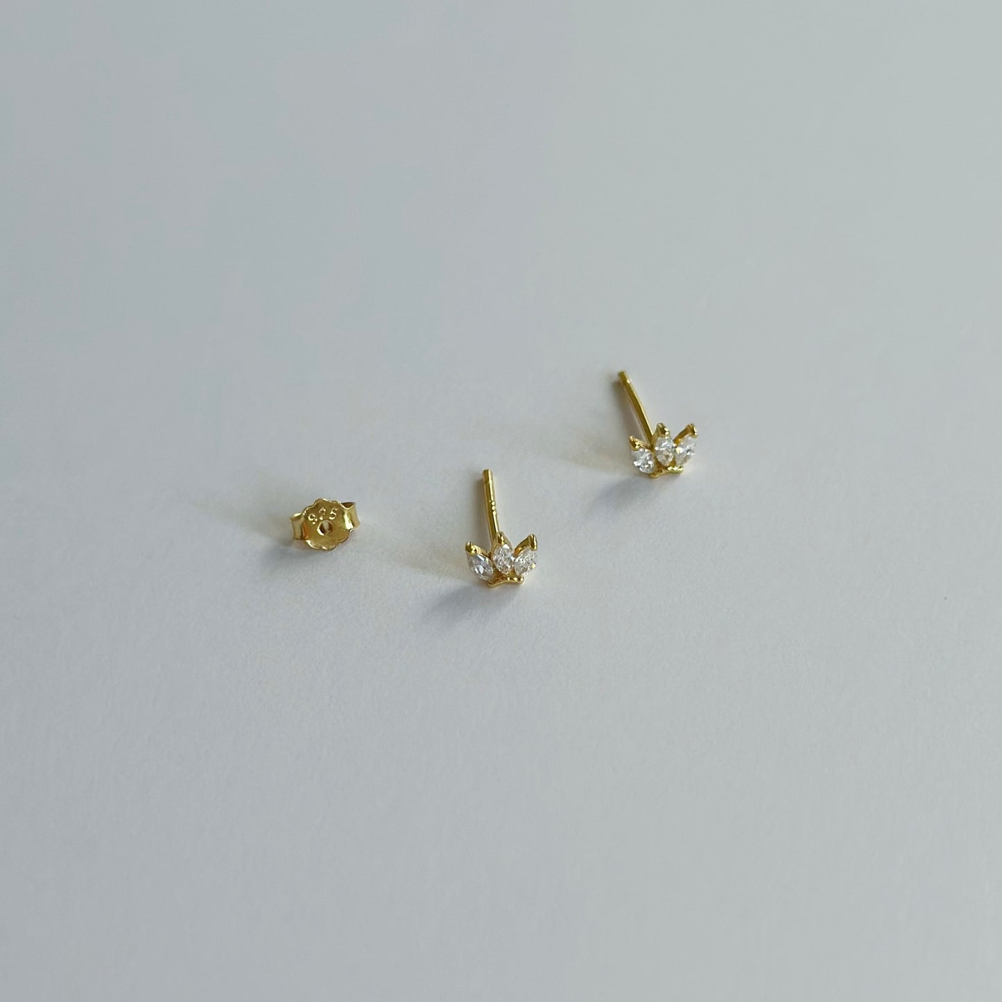 Gold three gem stud earrings