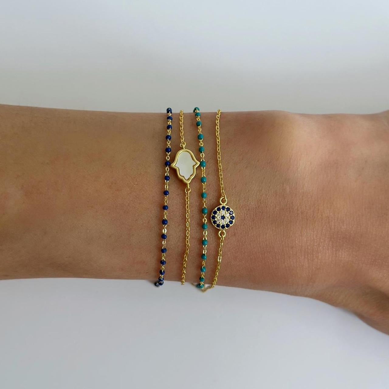 Gold mother of pearl hamsa hand bracelet