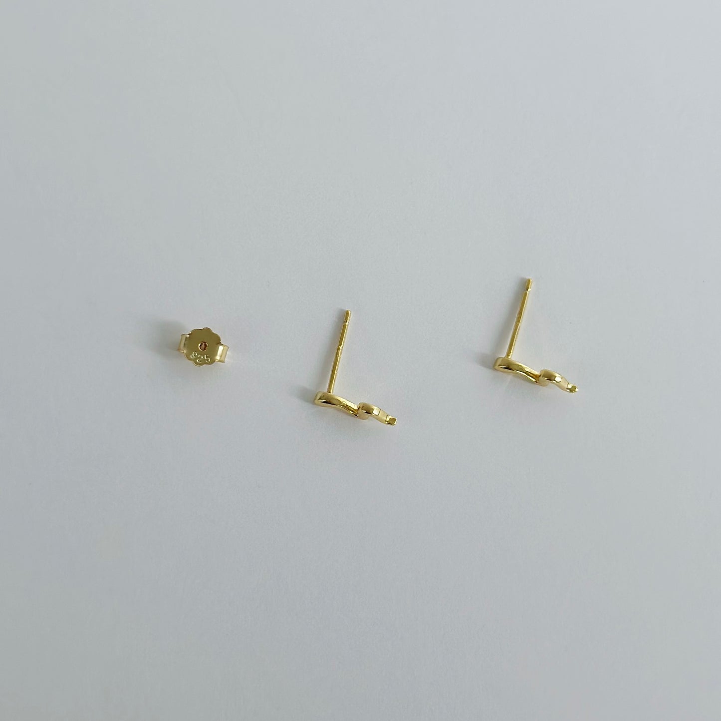 Gold snake stud earrings