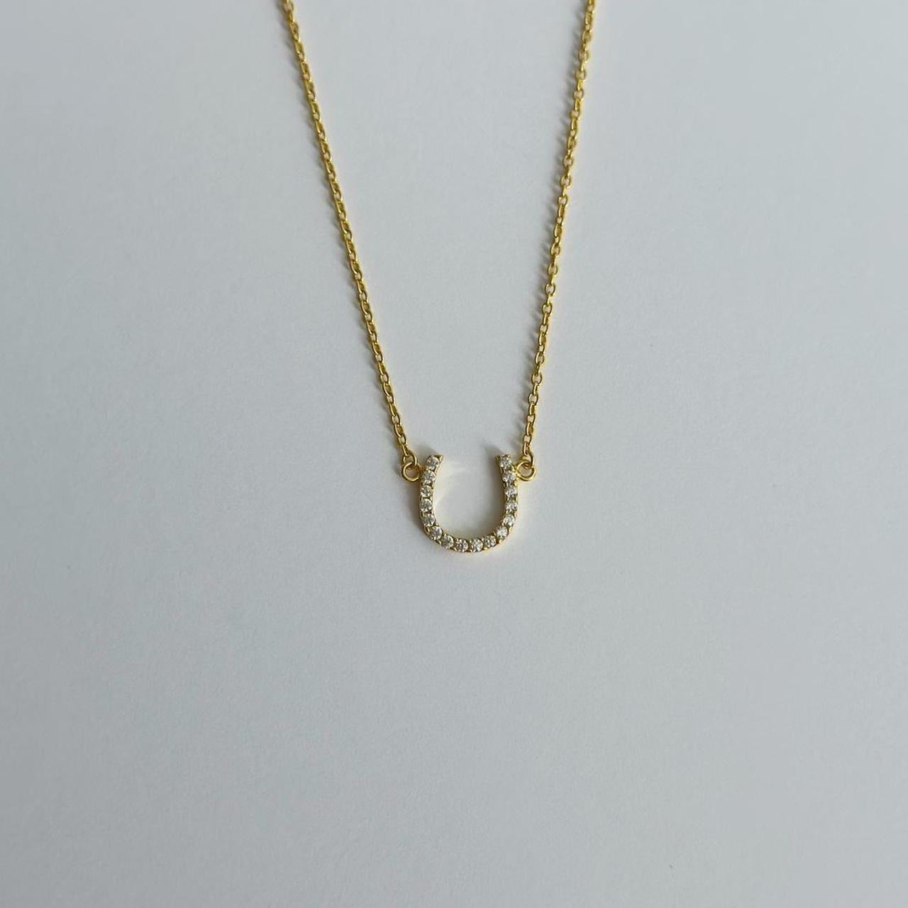 Gold horse shoe necklace