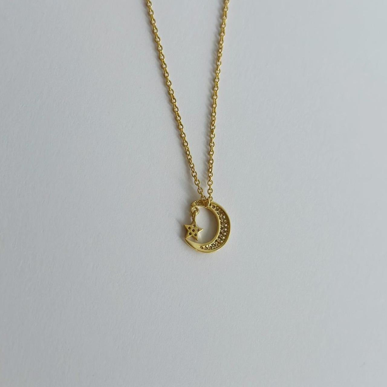 Gold moon & star pave necklace