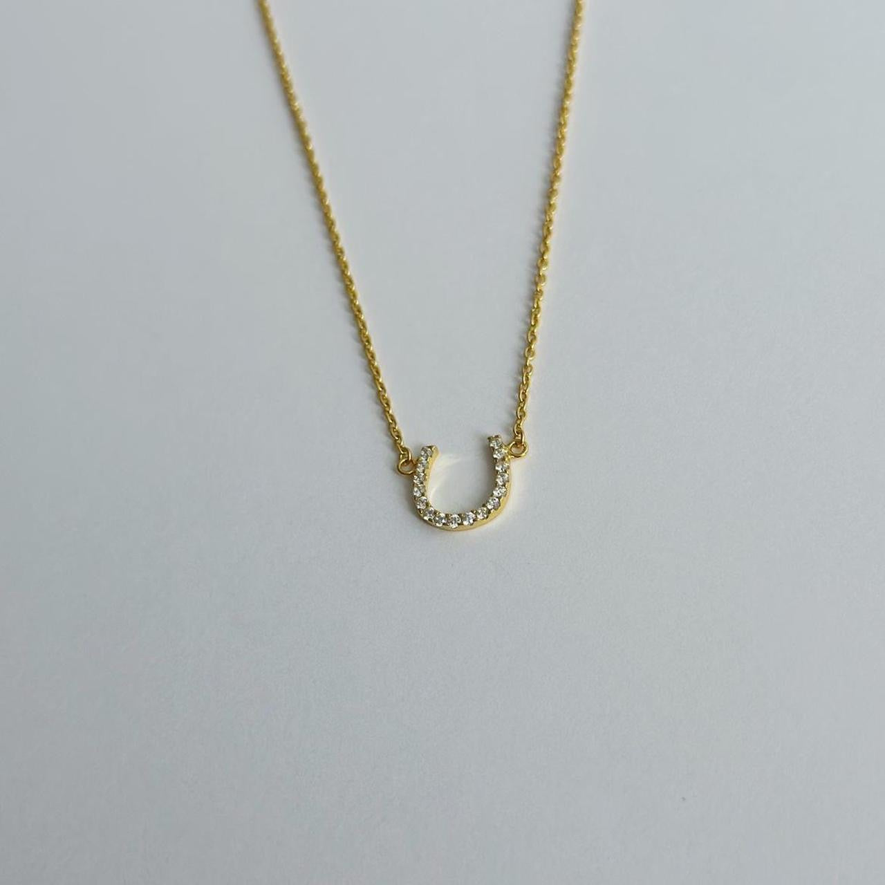 Gold horse shoe necklace