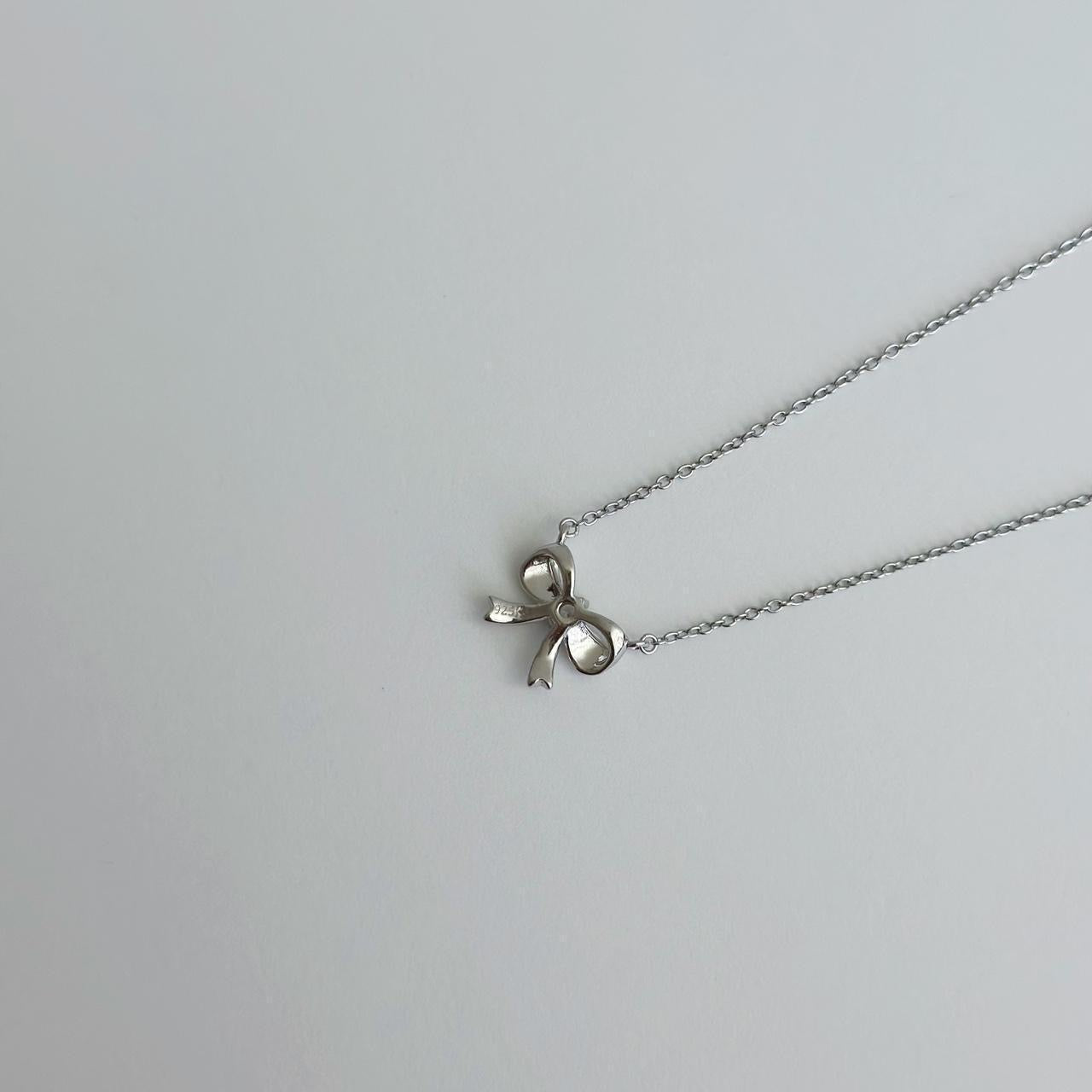 Silver ribbon bow necklace