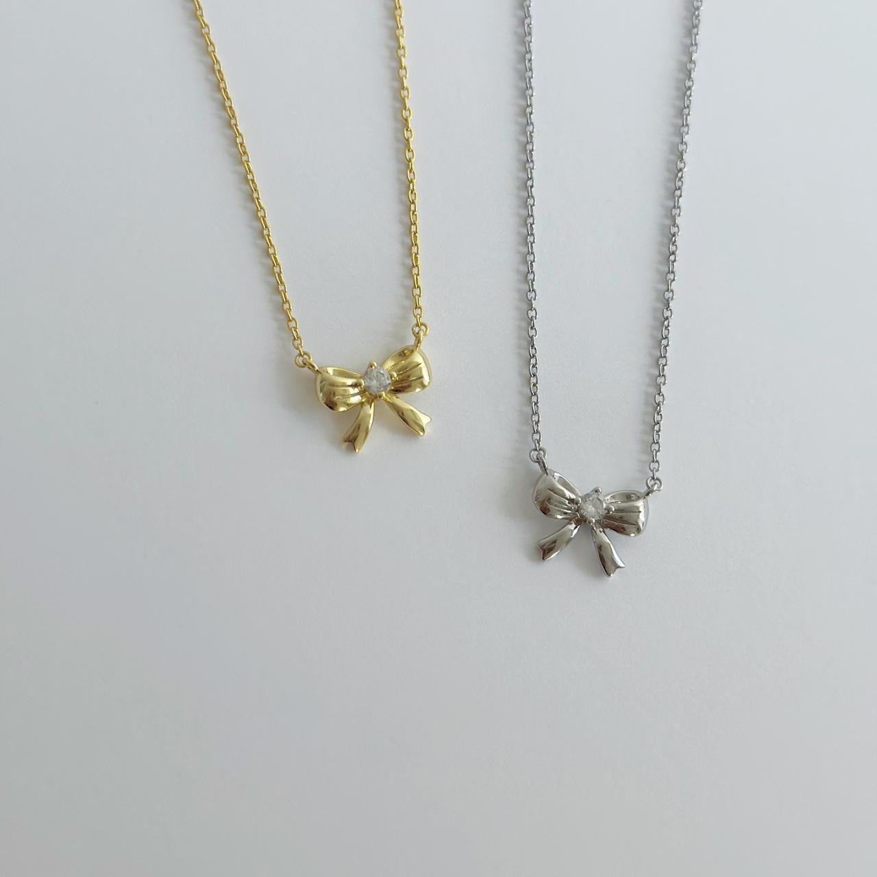 Gold ribbon bow necklace