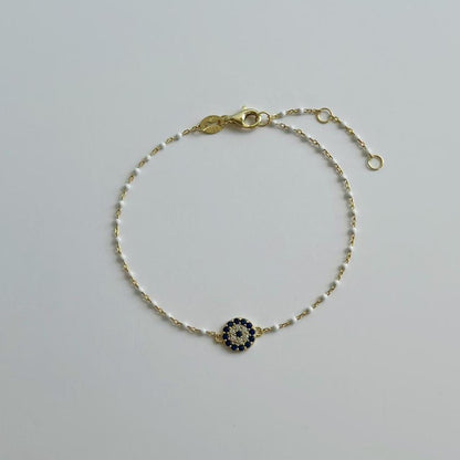 Gold pave evil eye white enamel bracelet