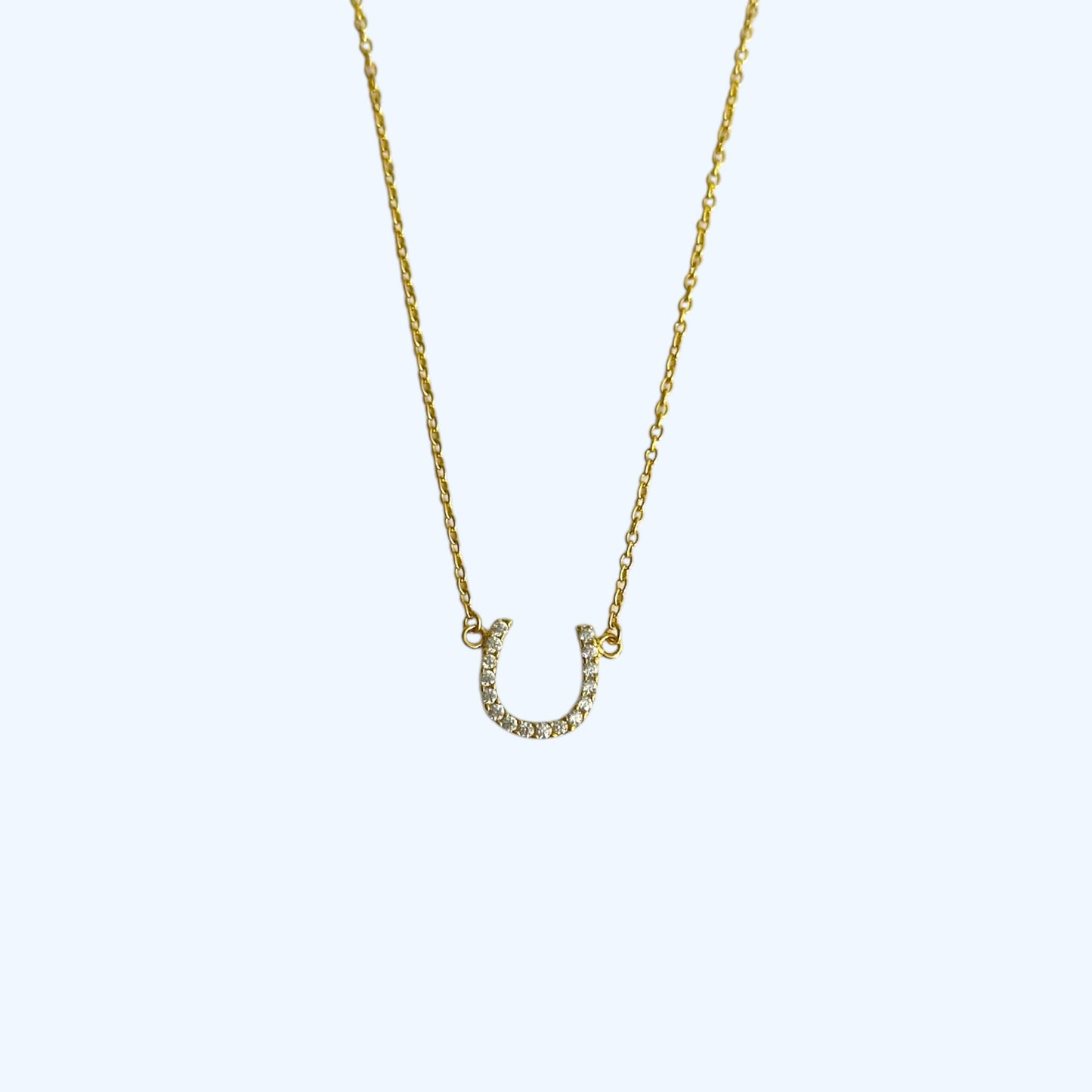 Gold horse shoe necklace