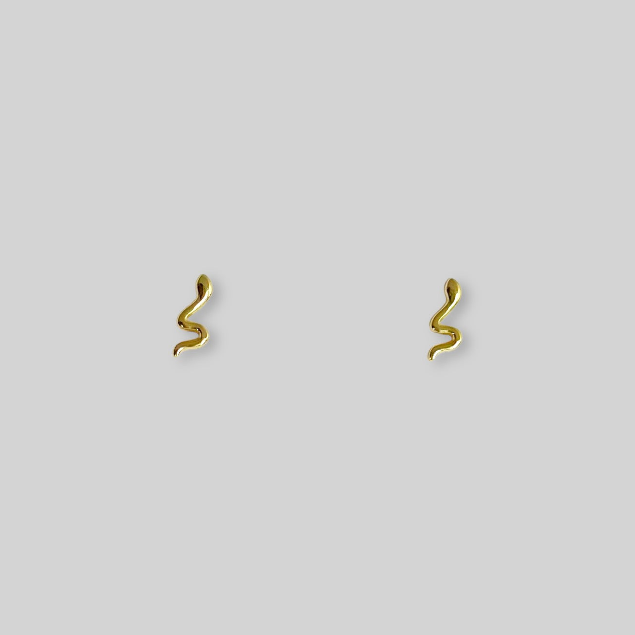 Gold snake stud earrings