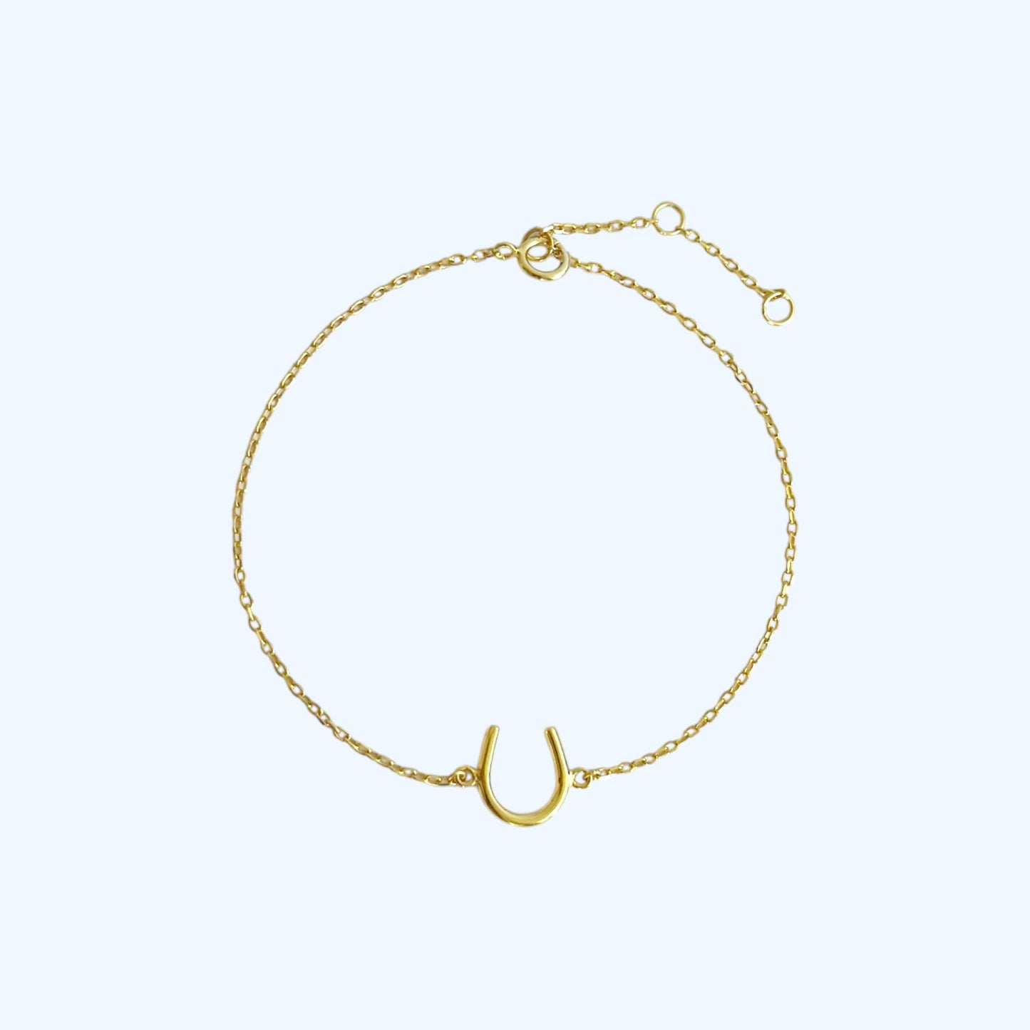 Gold horse shoe bracelet